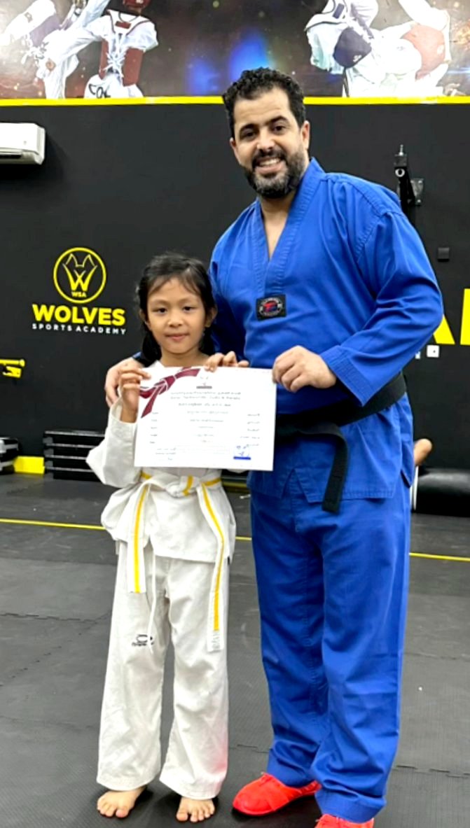 Coach Hijou with student at Wolves Sports Academy