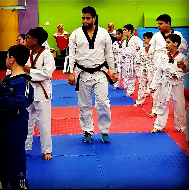 Coach Hijou with martial arts class on tatami